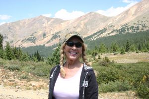 A woman in front of the mountains