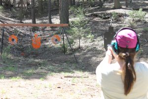 A woman firing on a shooting range